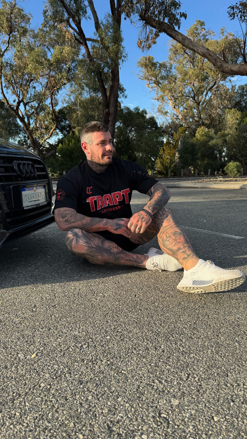Black and red shirt near car