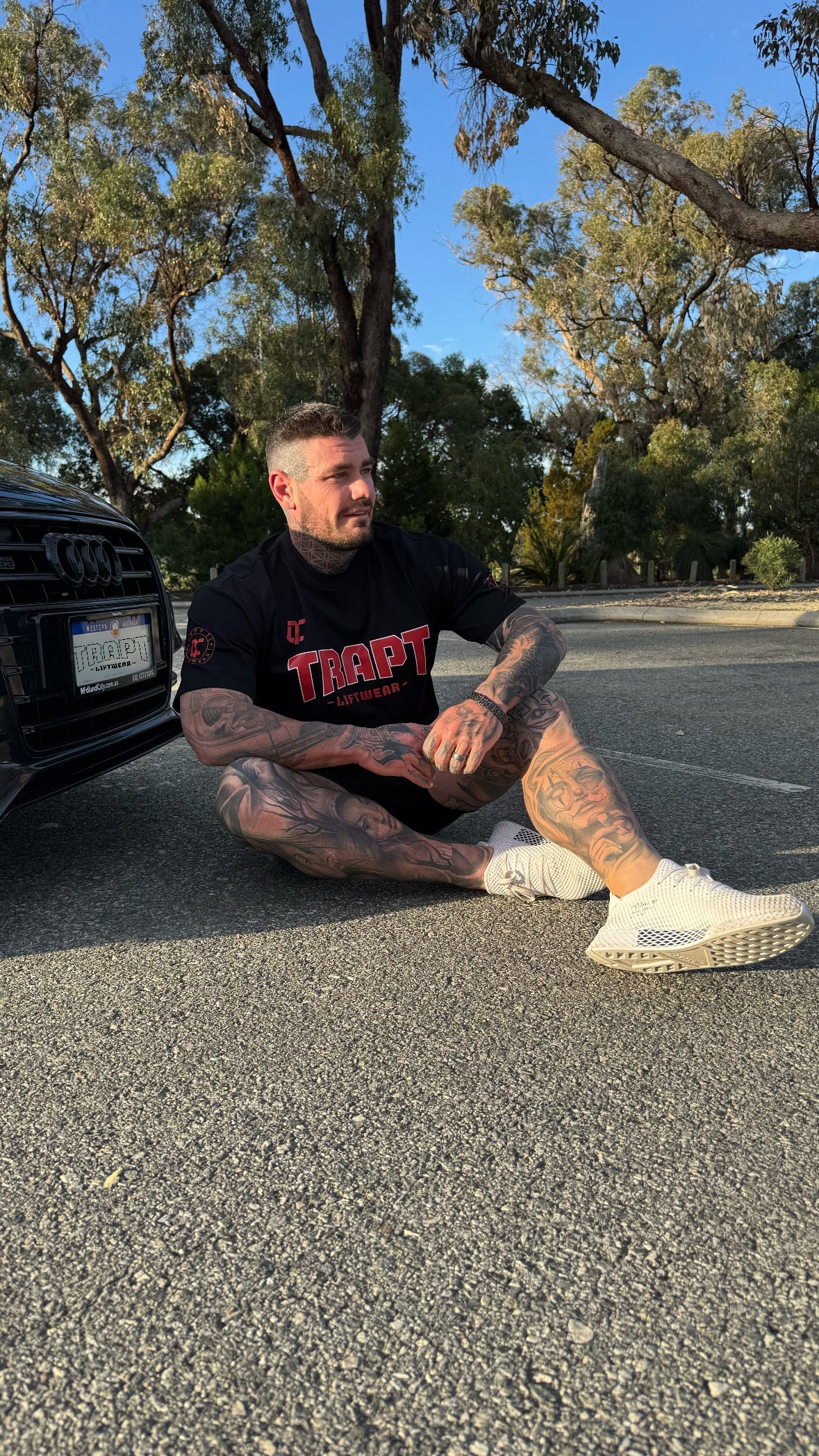 Black and red shirt near car