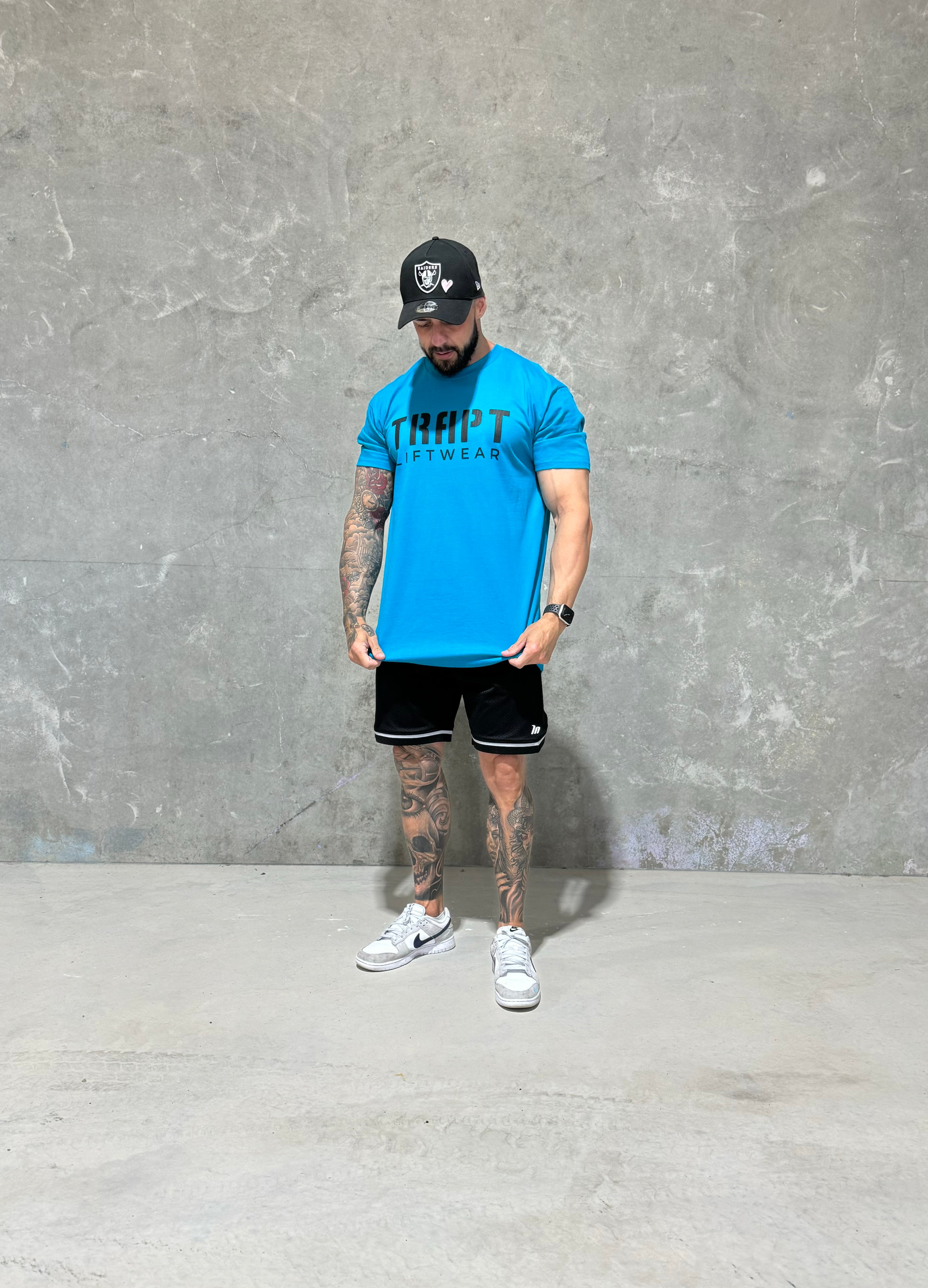 Teal with black writing TRAPT liftwear 