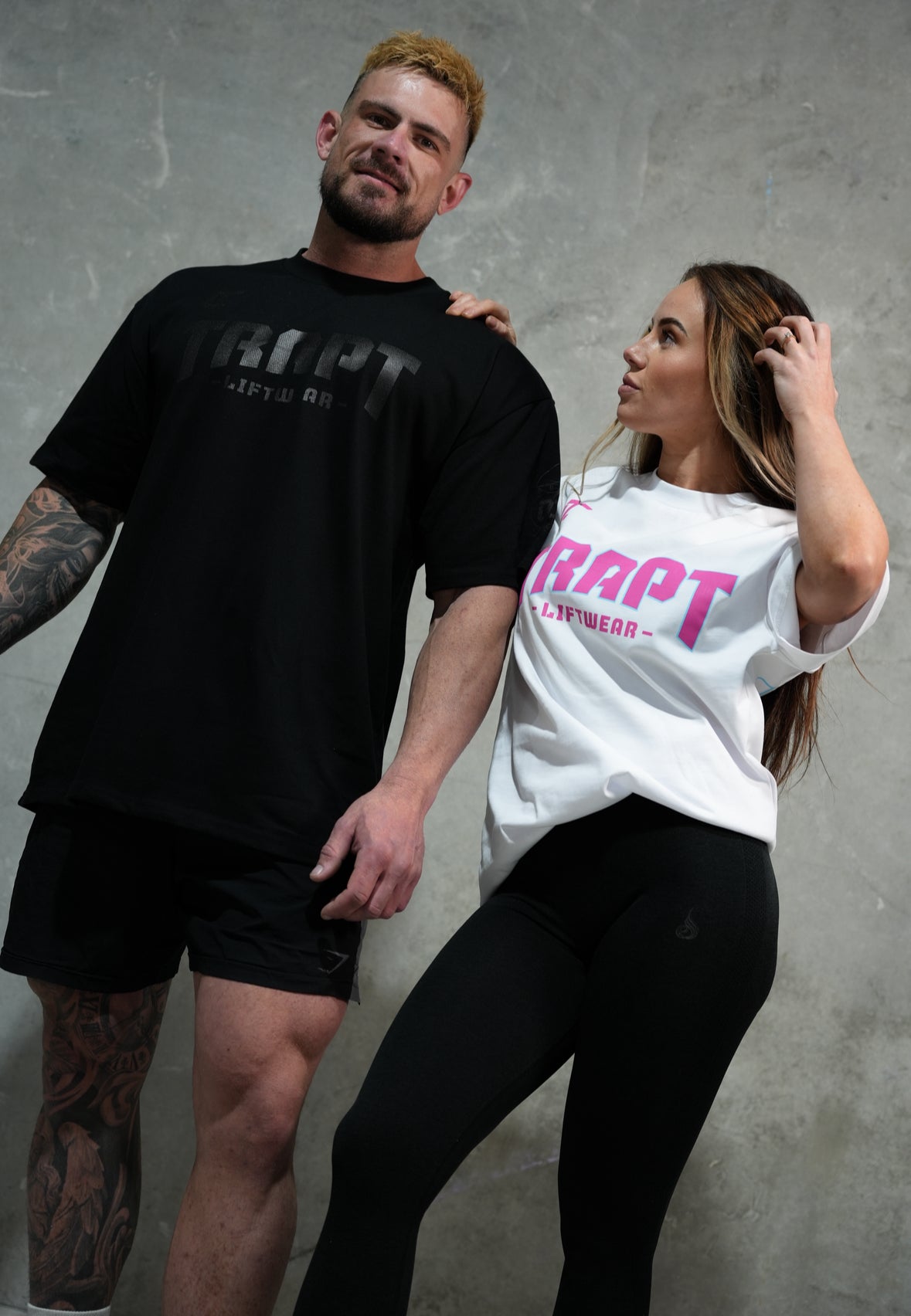 White and teal and black TRAPT liftwear 2 people 